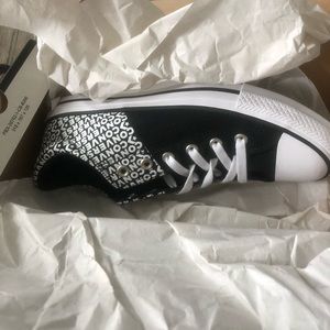 Black and White Low Cut Converse Sneakers...